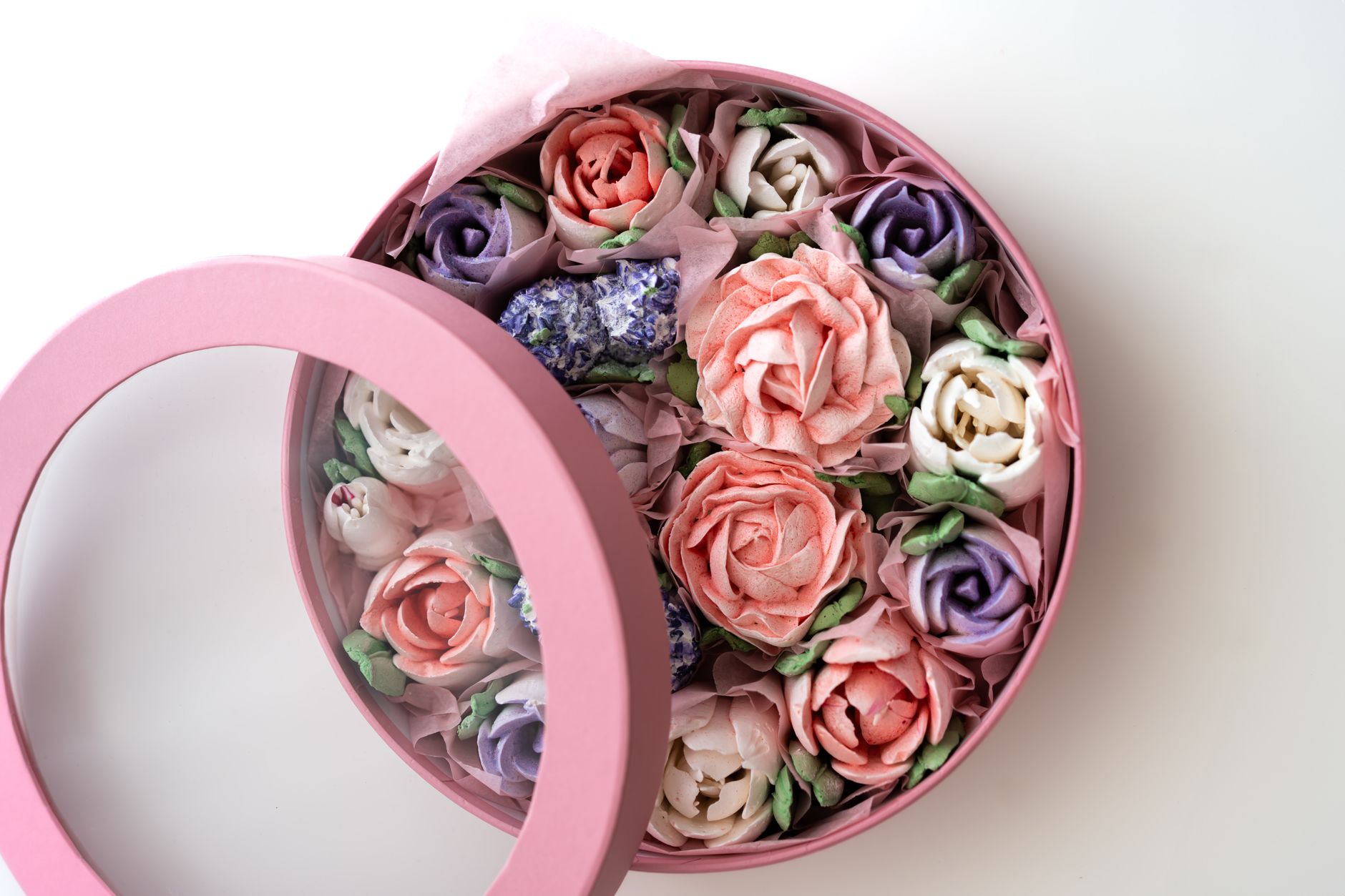 Top-down view of a flower delivery box filled with pastel roses
